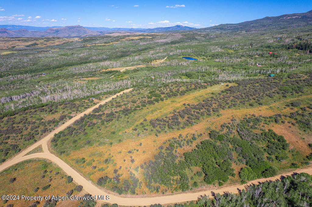 1750 Fiddleneck Drive Craig, CO 81625 - Photo 13 of 16 a view of a yard with a lake