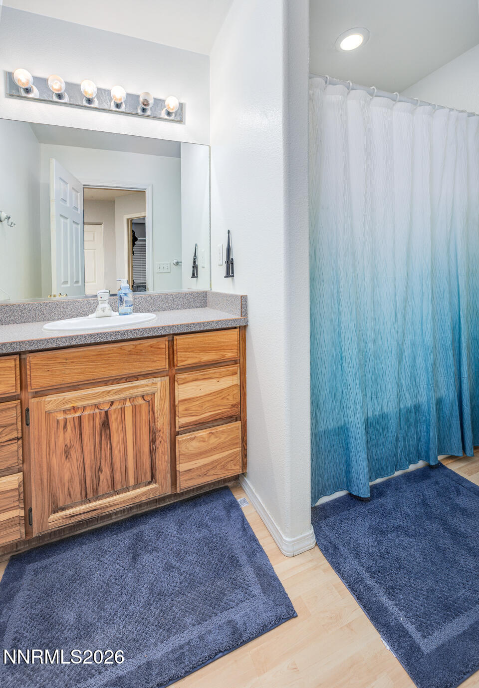 374 Calaway Court Fallon, NV 89406 - Photo 13 of 18 a view of a bathroom with a sink and mirror