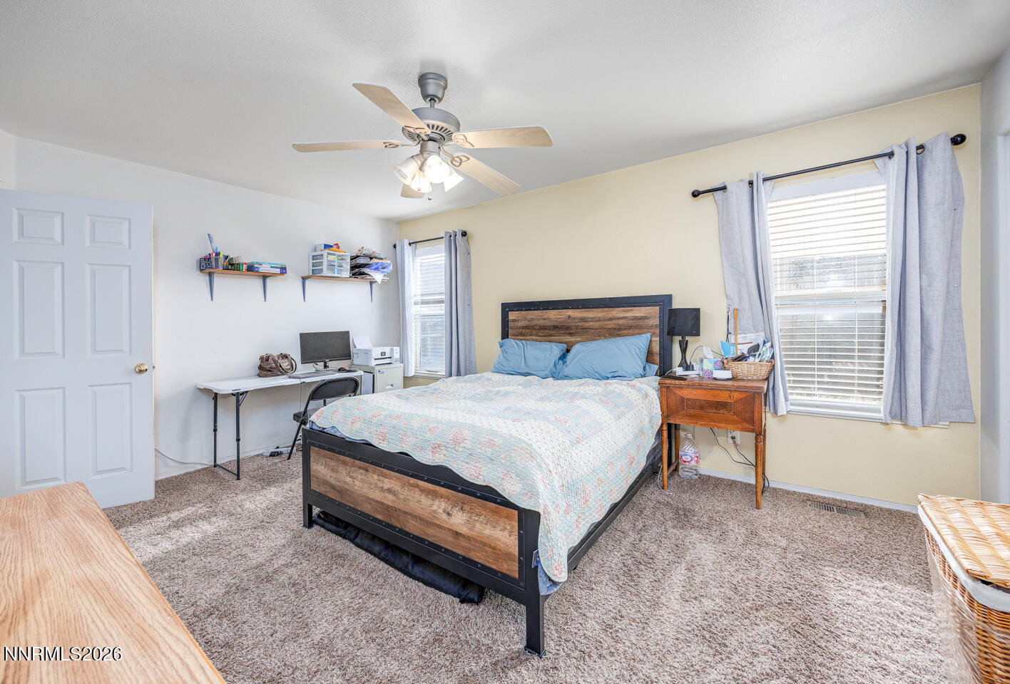 374 Calaway Court Fallon, NV 89406 - Photo 9 of 18 a bedroom with a bed and a chandelier