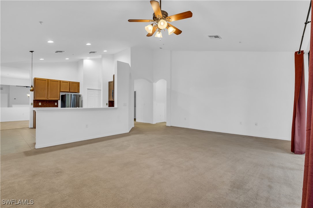 3799 Costa Maya Way, Unit 202 Estero, FL 33928 - Photo 11 of 42 a view of a kitchen with a sink and a refrigerator