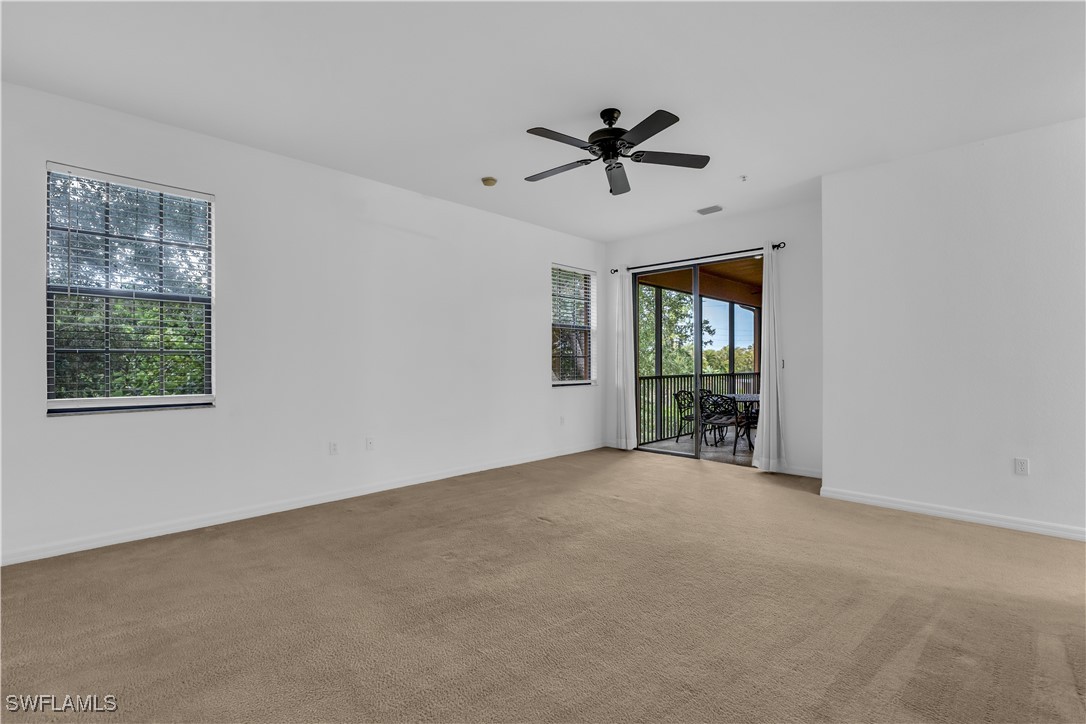 3799 Costa Maya Way, Unit 202 Estero, FL 33928 - Photo 27 of 42 a view of an empty room with a window