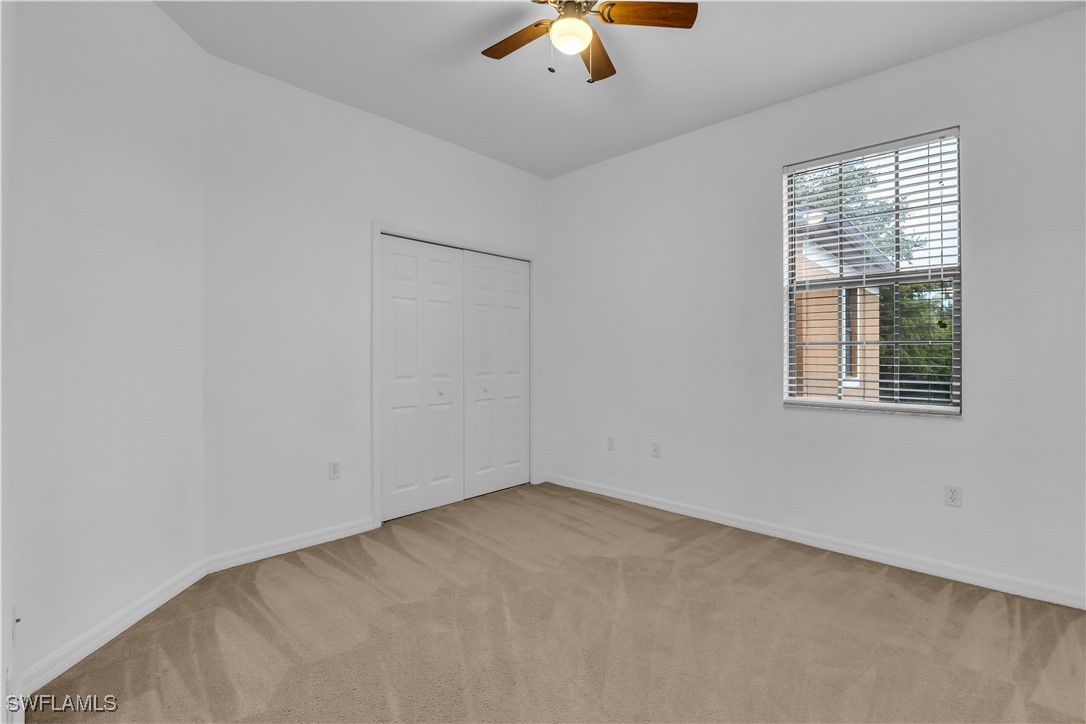 3799 Costa Maya Way, Unit 202 Estero, FL 33928 - Photo 28 of 42 an empty room with a window