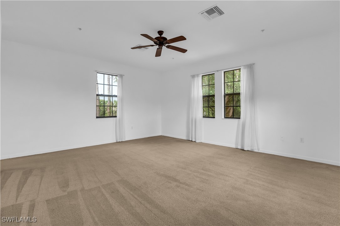 3799 Costa Maya Way, Unit 202 Estero, FL 33928 - Photo 33 of 42 a view of an empty room with a window