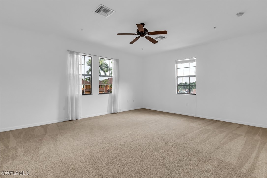 3799 Costa Maya Way, Unit 202 Estero, FL 33928 - Photo 34 of 42 a view of an empty room with a window