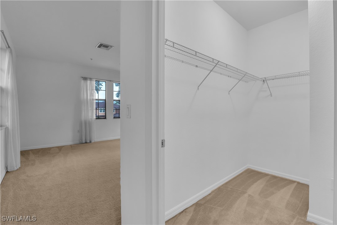 3799 Costa Maya Way, Unit 202 Estero, FL 33928 - Photo 35 of 42 a view of an empty room with a window