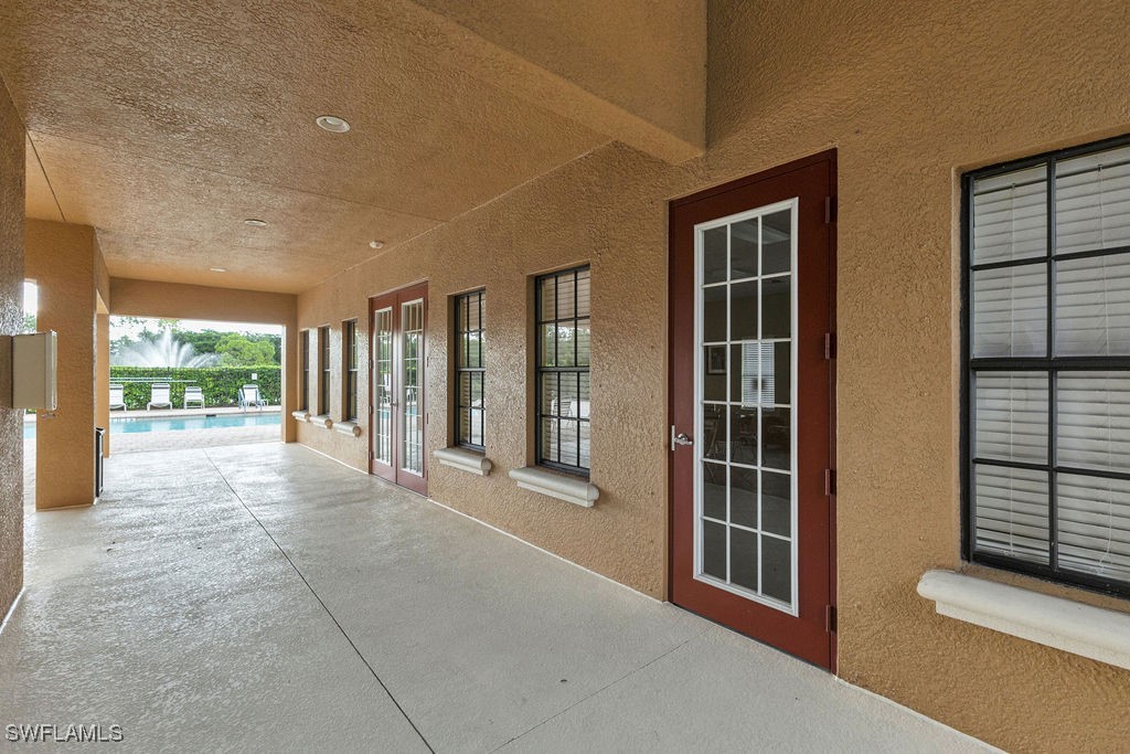 3799 Costa Maya Way, Unit 202 Estero, FL 33928 - Photo 39 of 42 a view of an entryway with a floor to ceiling window and an entryway