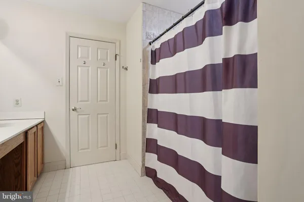 a bathroom with a bathtub and shower