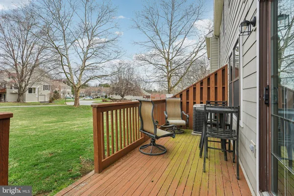 a view of balcony with deck and wooden floor