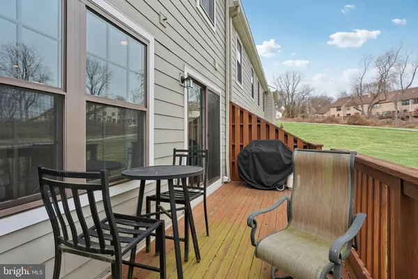 a view of a balcony with chairs and a table