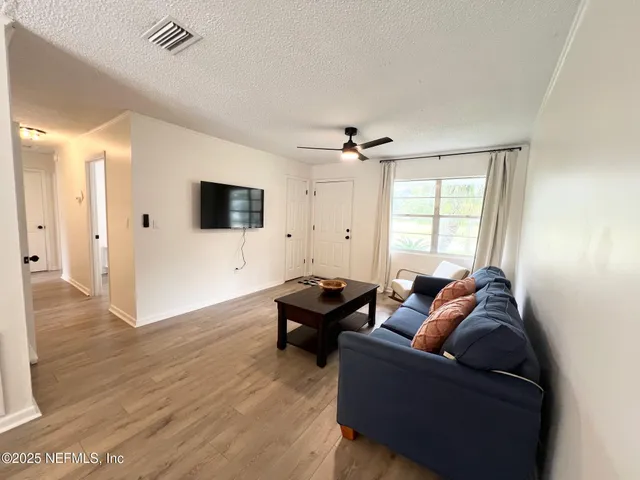 a living room with furniture and a window