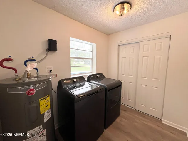 a utility room with dryer and washer