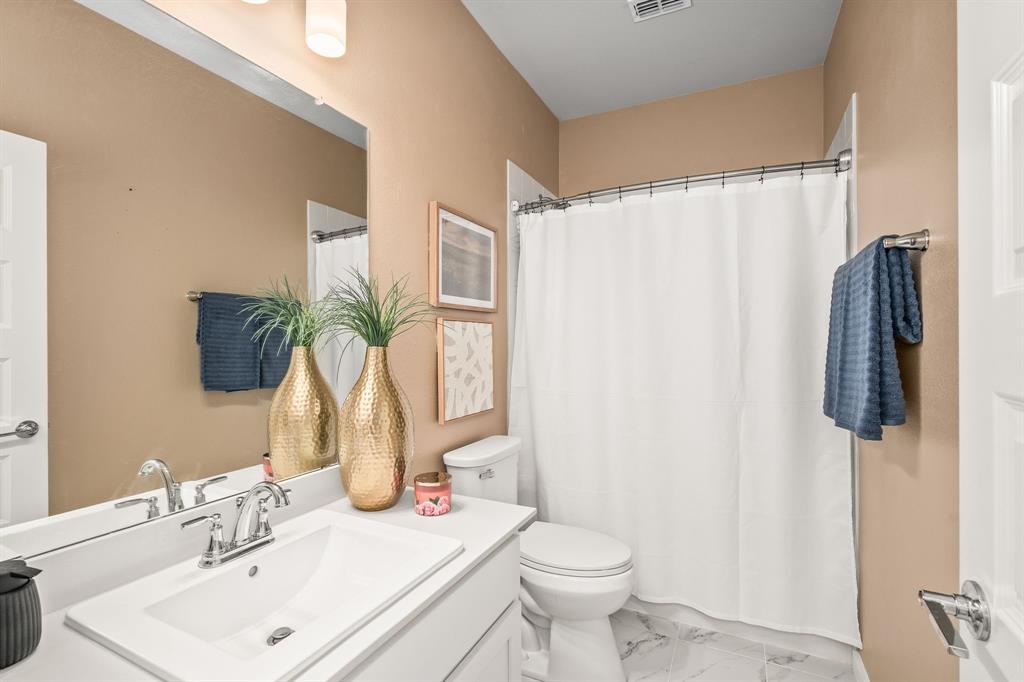 4017 Mapleleaf Pass Melissa, TX 75454 - Photo 17 of 32 a bathroom with a sink toilet and shower