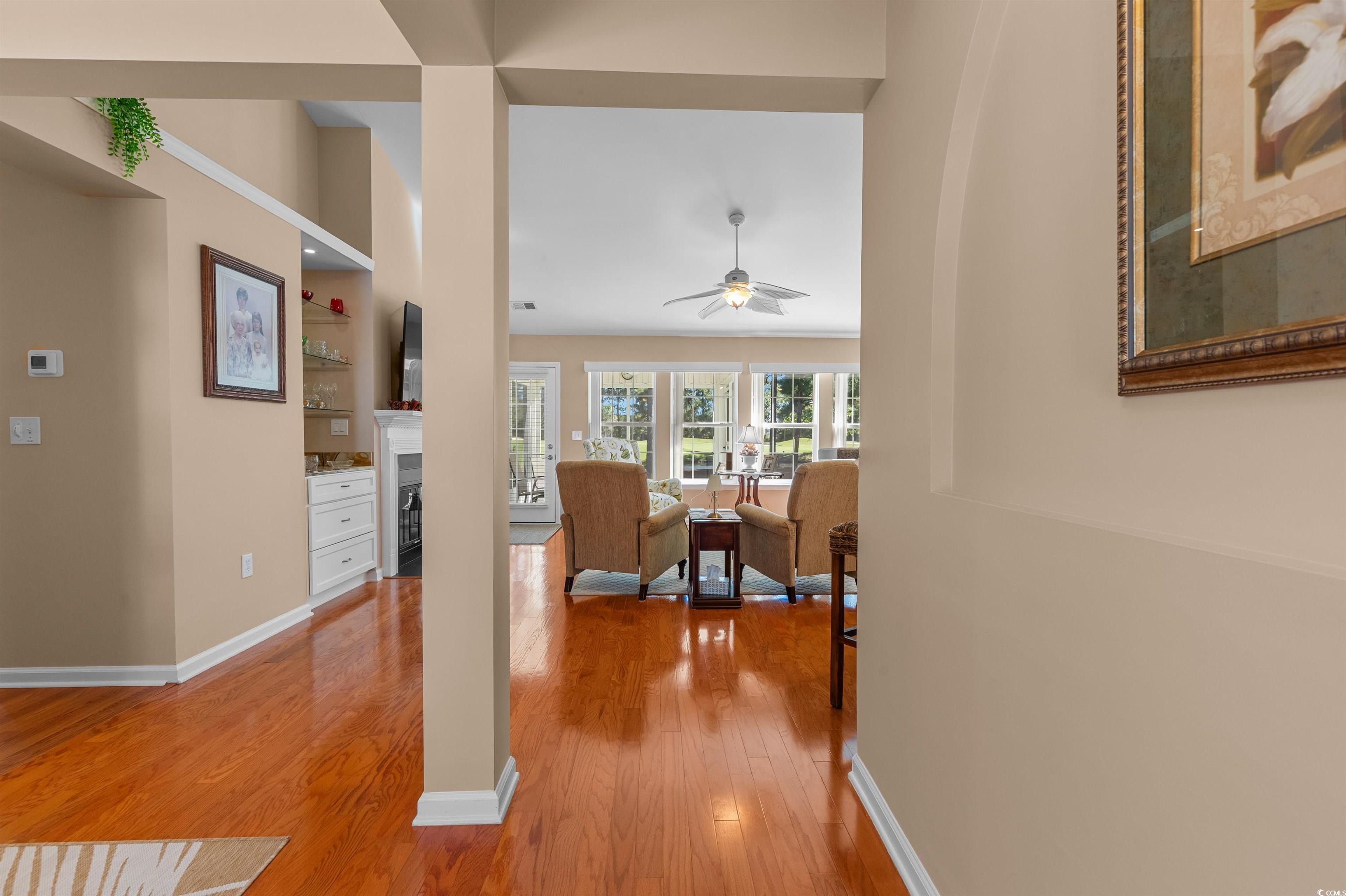 3505 Arrowhead Boulevard Myrtle Beach, SC 29579 - Photo 3 of 40 Living room with light wood-type flooring, a fireplace, and ceiling fan