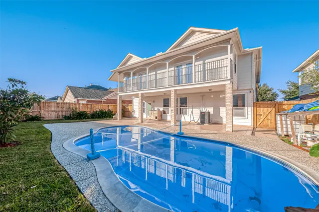 a view of a house with a swimming pool