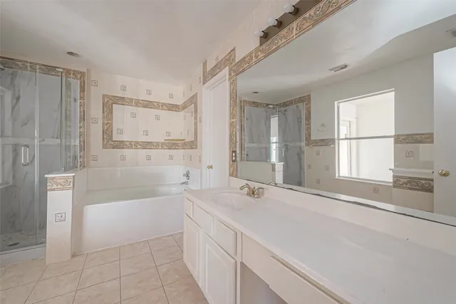 a bathroom with a tub sink and a shower