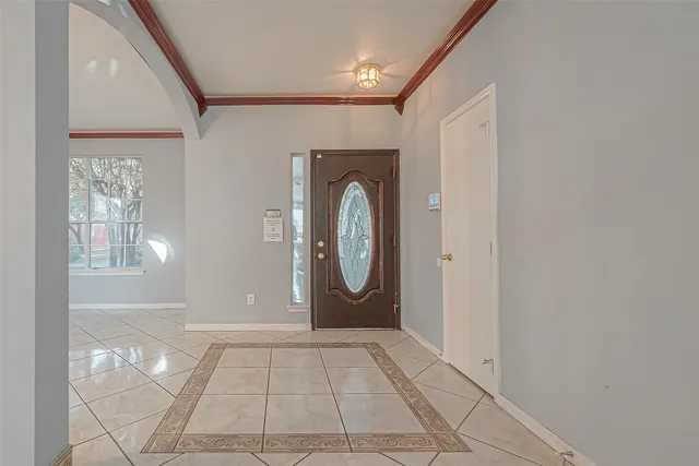 a view of a livingroom with wooden floor and a large window