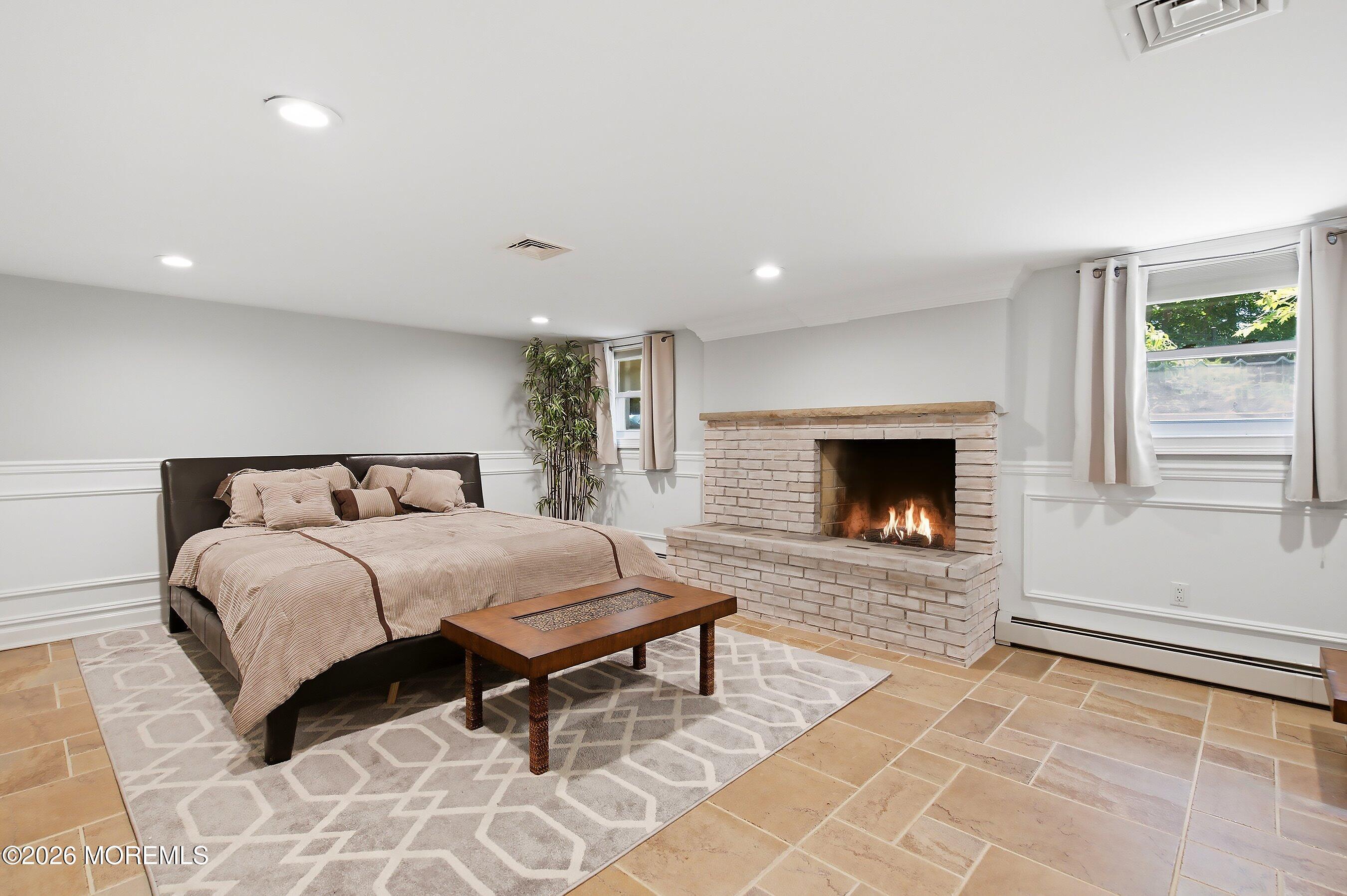 108 Heulitt Road Colts Neck, NJ 07722 - Photo 40 of 50 75-Basement Bed 2 with Fire