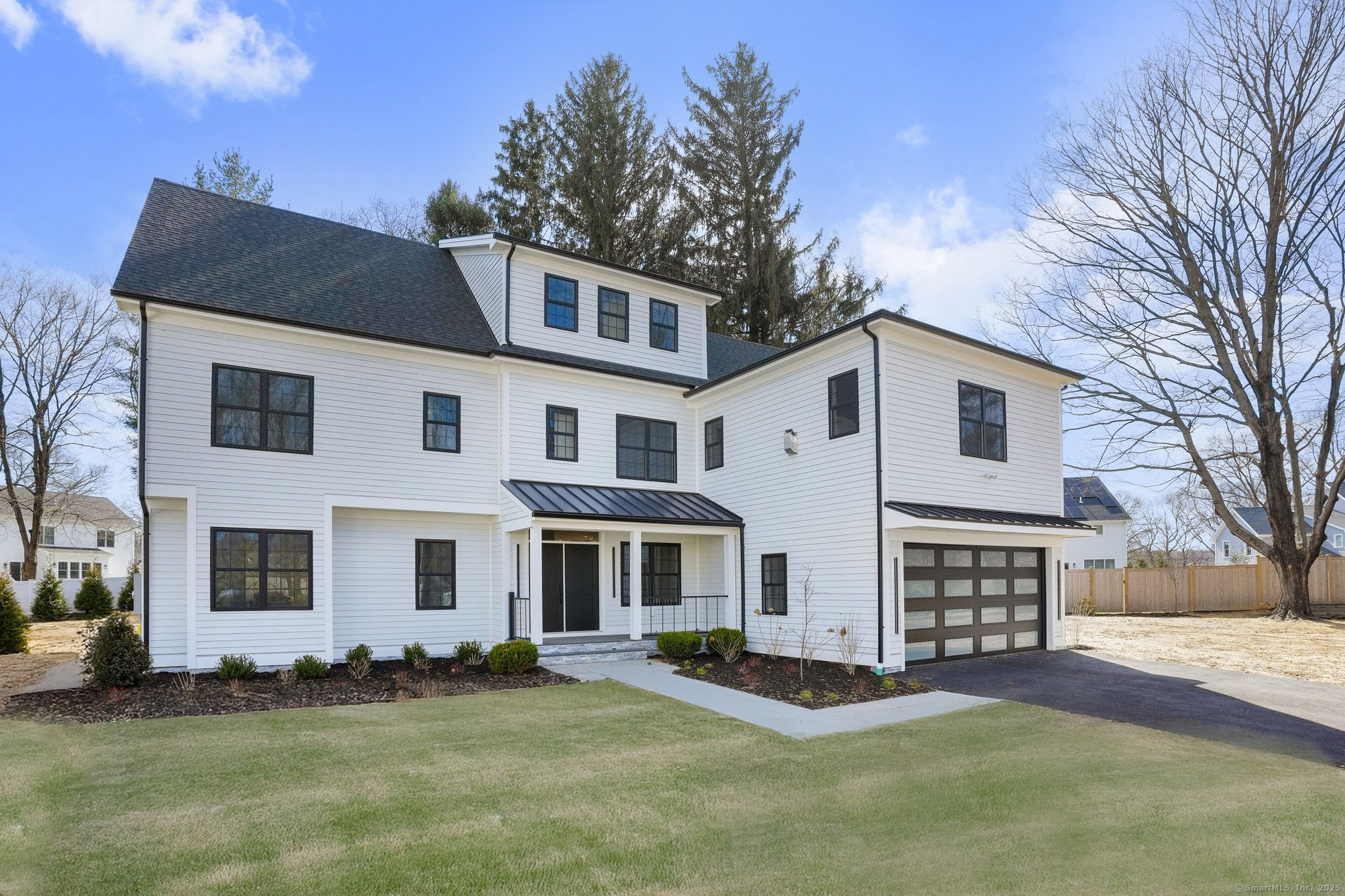 43 Newport Place Fairfield, CT 06825 - Photo 1 of 1 a front view of a house with a yard