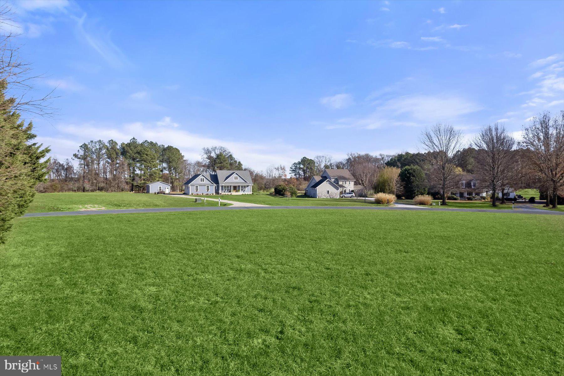30 Hagy Road Rock Hall, MD 21661 - Photo 17 of 46 a view of yard with green space and trees in the background