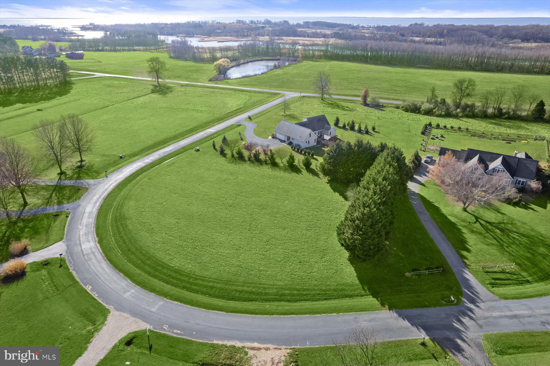 30 Hagy Road Rock Hall, MD 21661 - Photo 10 of 46 an aerial view of a golf course with a garden