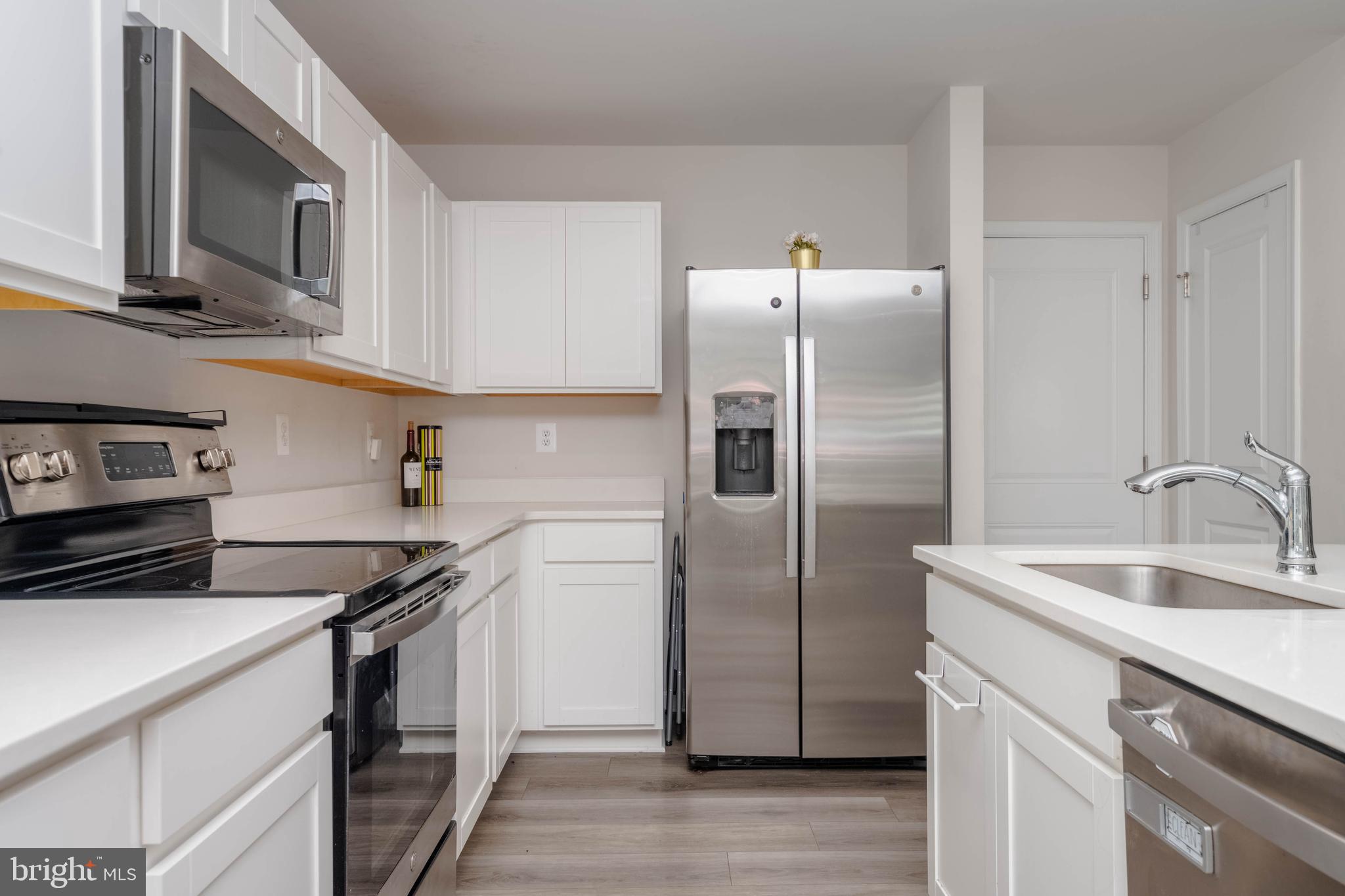 25 Teatree Lane Elkton, MD 21921 - Photo 14 of 38 a kitchen with stainless steel appliances granite countertop a sink stove and refrigerator