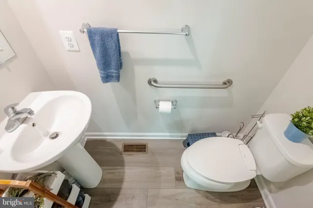 a bathroom with a sink and toilet
