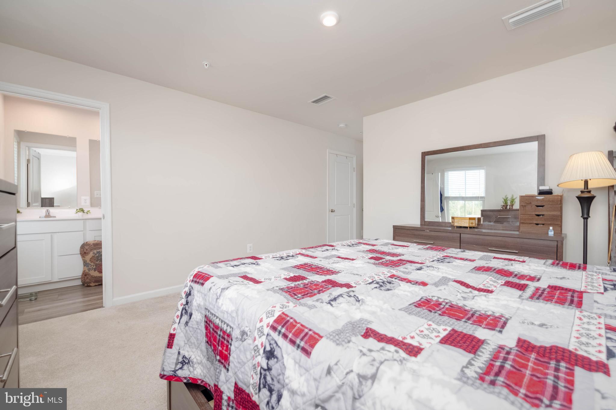 25 Teatree Lane Elkton, MD 21921 - Photo 21 of 38 a bedroom with a bed and a chandelier