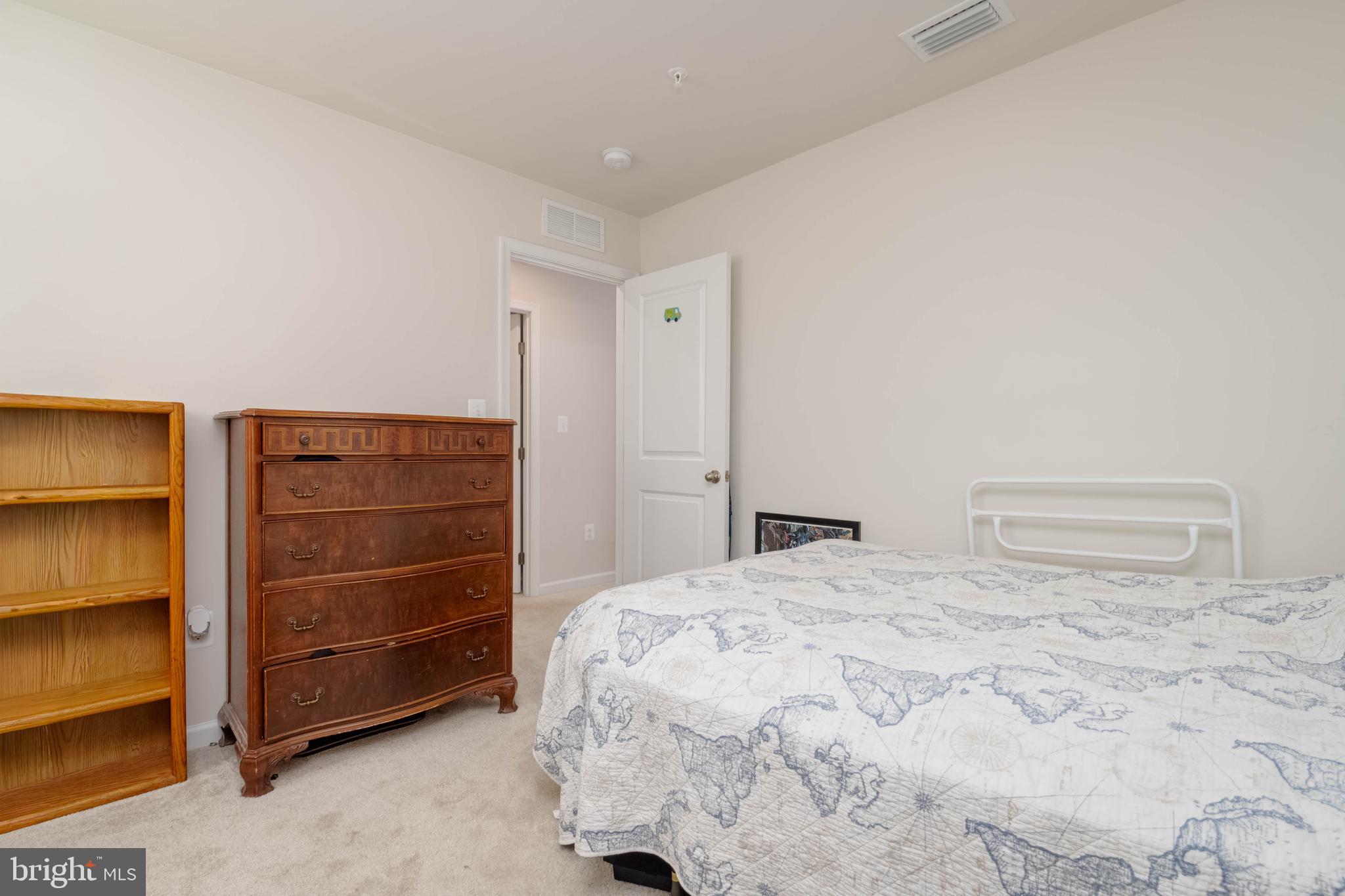 25 Teatree Lane Elkton, MD 21921 - Photo 27 of 38 a bedroom with a bed and a cabinets
