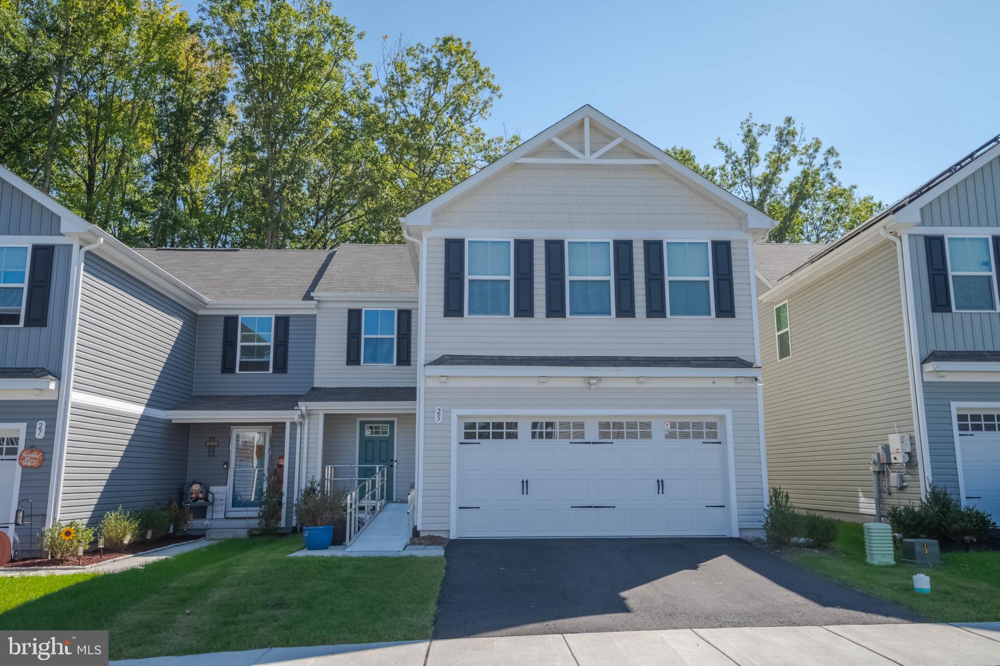 25 Teatree Lane Elkton, MD 21921 - Photo 4 of 38 a front view of a house with a yard and potted plants