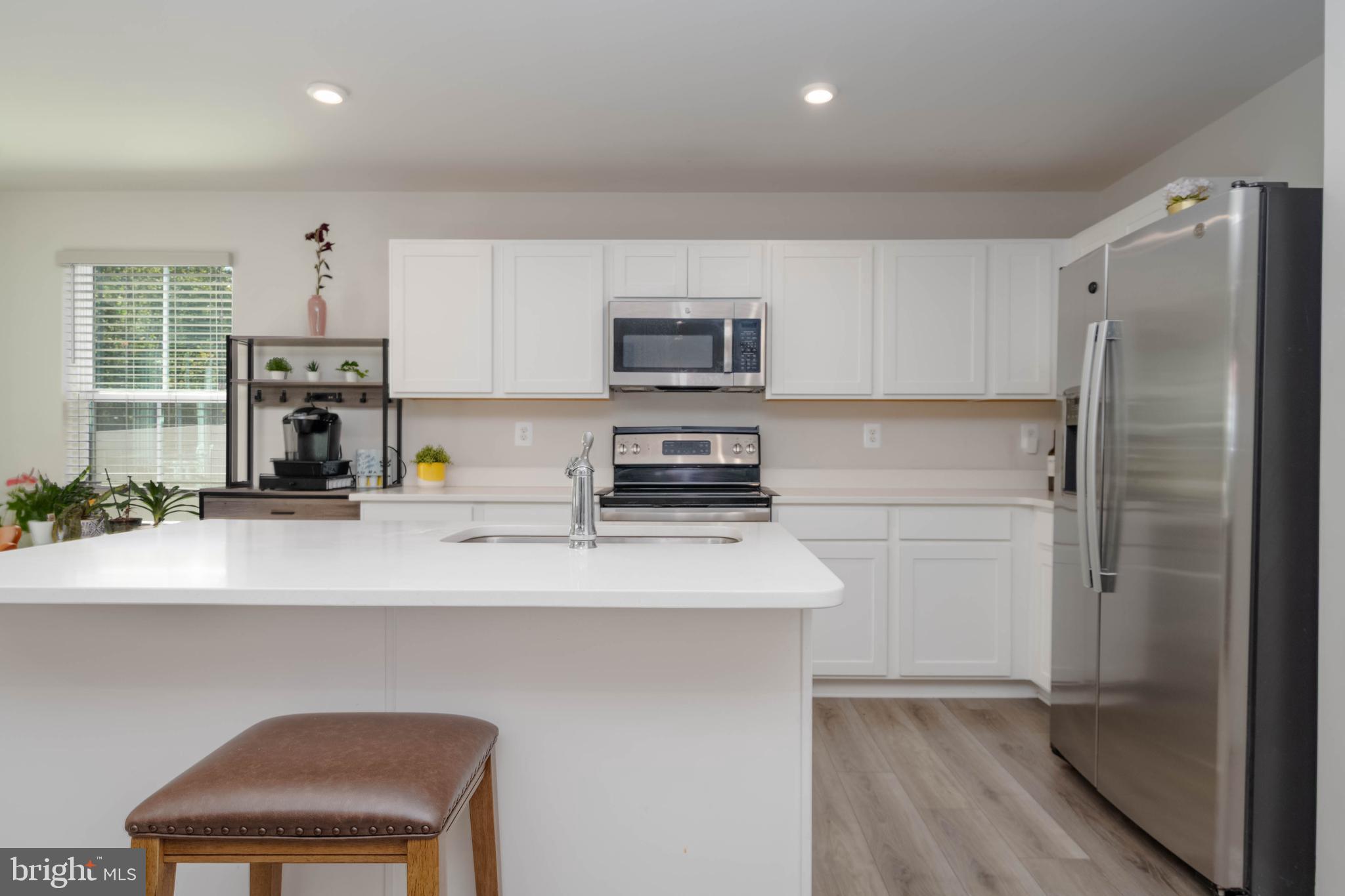 25 Teatree Lane Elkton, MD 21921 - Photo 10 of 38 a kitchen with a refrigerator and a chair