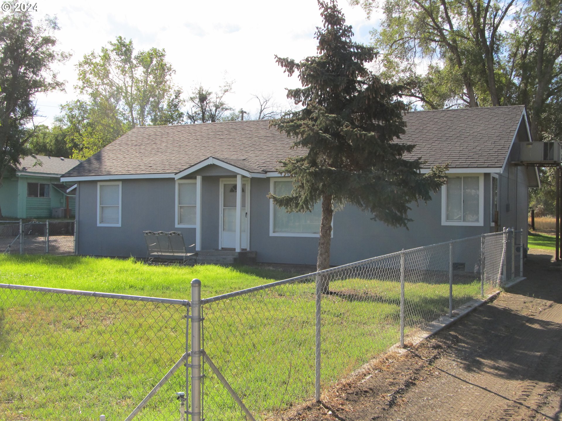1890 East Hooker Road Hermiston, OR 97838 - Photo 5 of 32 a view of a house with a backyard