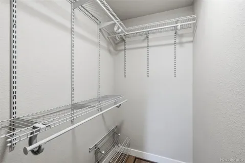 a view of a room that has a table and a chair