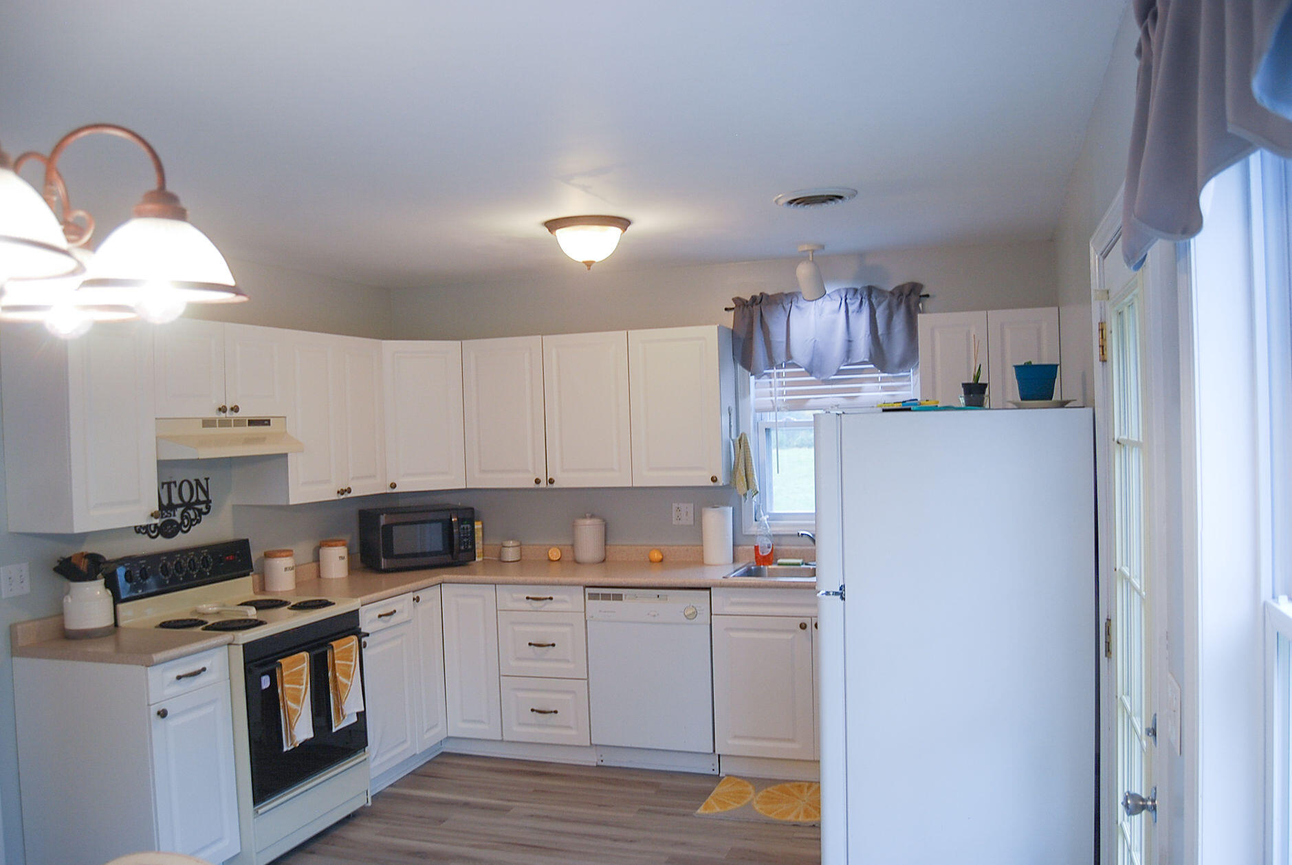 410 Mill Run Road Chatham, VA 24531 - Photo 23 of 34 a kitchen with stainless steel appliances granite countertop a refrigerator sink and stove