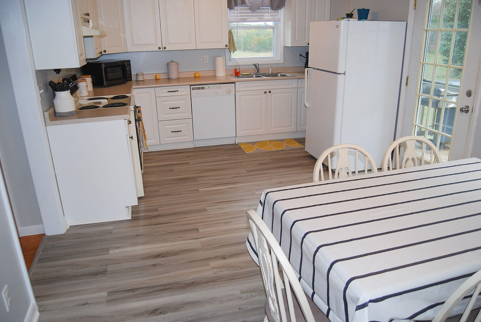 410 Mill Run Road Chatham, VA 24531 - Photo 24 of 34 a kitchen with appliances a sink and cabinets