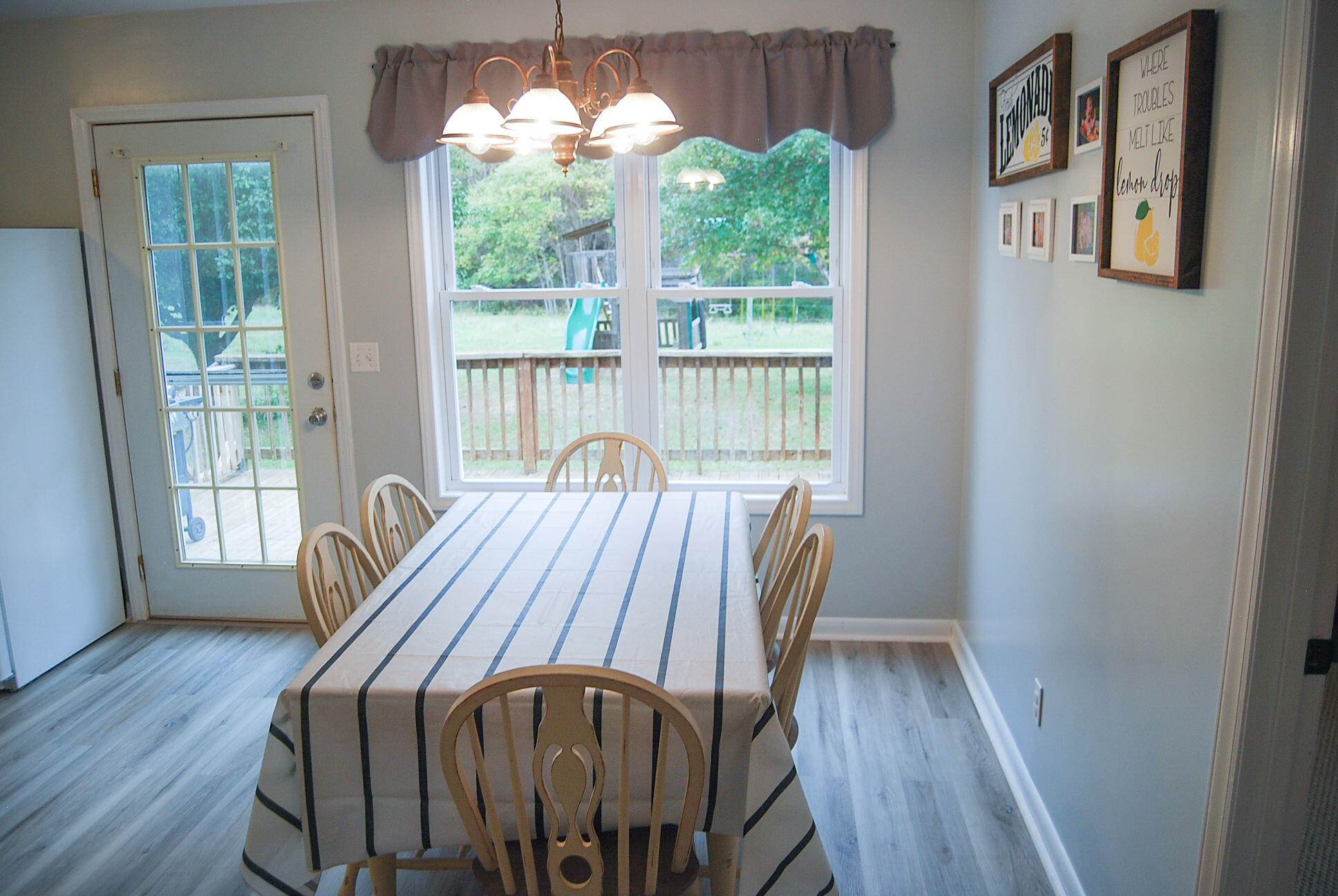410 Mill Run Road Chatham, VA 24531 - Photo 25 of 34 a view of a dining room with furniture a chandelier and wooden floor