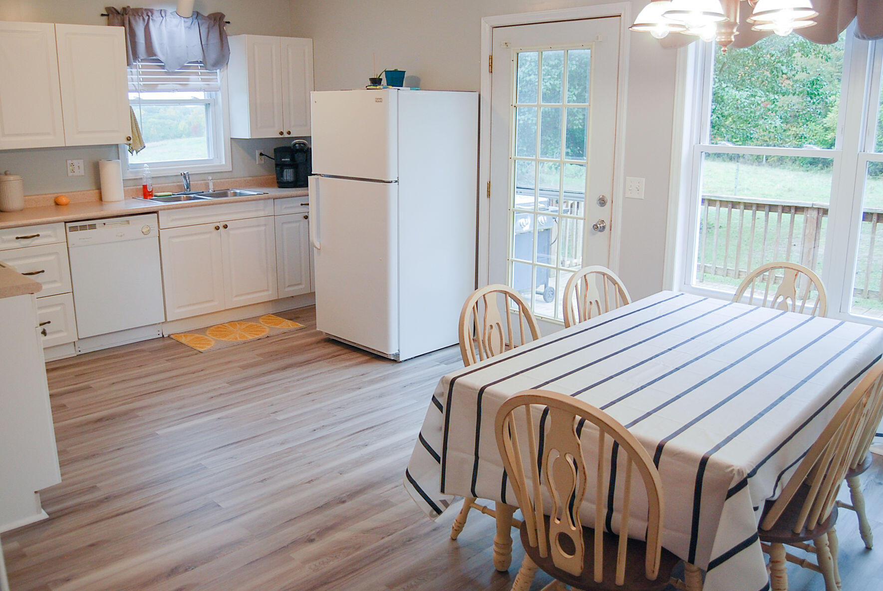 410 Mill Run Road Chatham, VA 24531 - Photo 27 of 34 a bedroom with a bed next to a large window with wooden floor