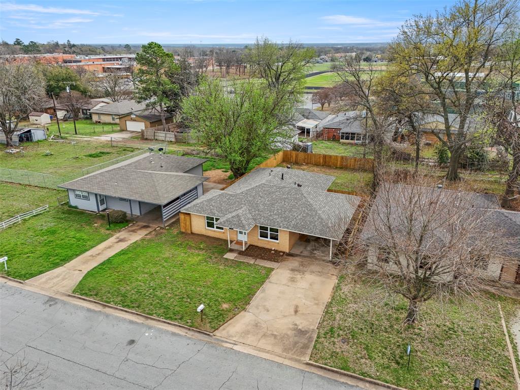 732 Bullock Street Denison, TX 75020 - Photo 26 of 29 an aerial view of a house with garden space and street view