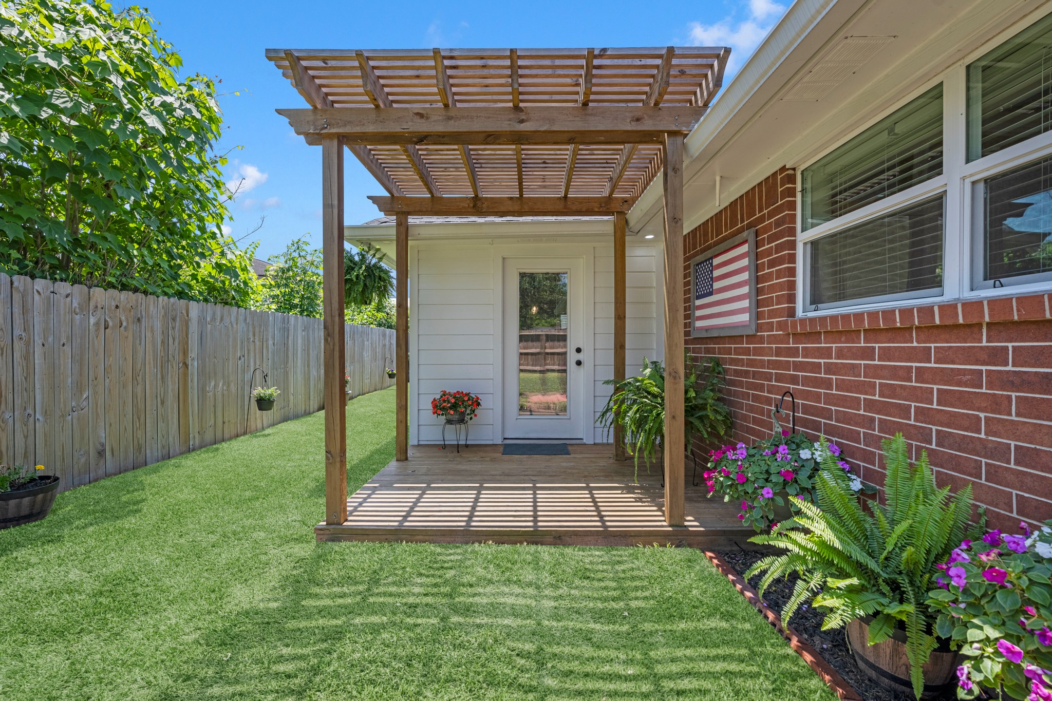 606 Walnut Street Sweeny, TX 77480 - Photo 27 of 28 a view of a porch with a yard