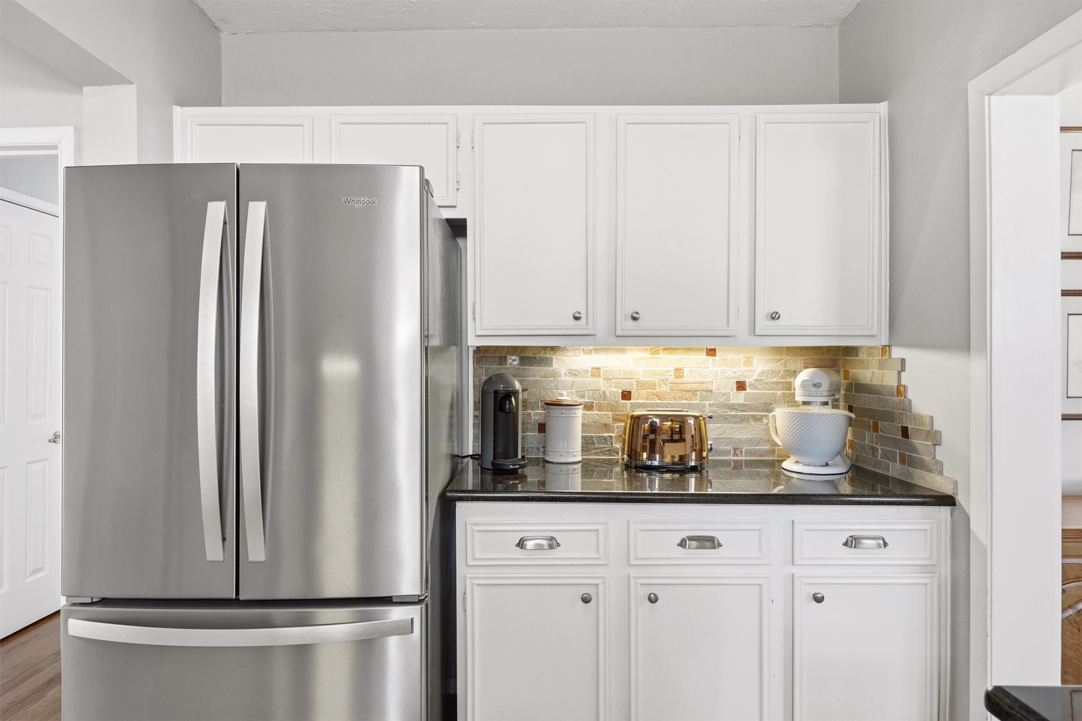 1507 Wethersfield Road Austin, TX 78703 - Photo 17 of 40 a kitchen with stainless steel appliances a refrigerator and cabinets