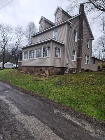 a house that has a lot of plants in it