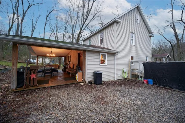 a view of a balcony with furniture and wooden floor