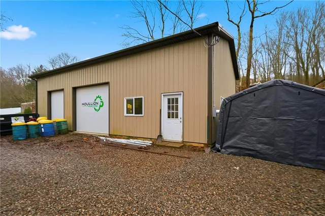 a kitchen with granite countertop stainless steel appliances a refrigerator sink and microwave