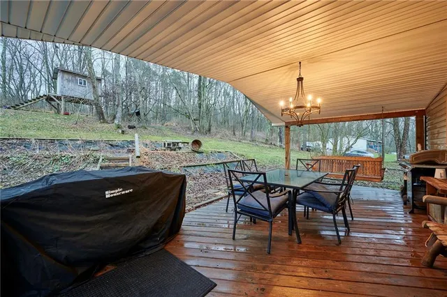 a kitchen with sink refrigerator and window
