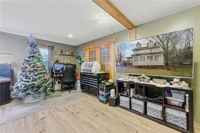 a bedroom with lots of different colored cloths