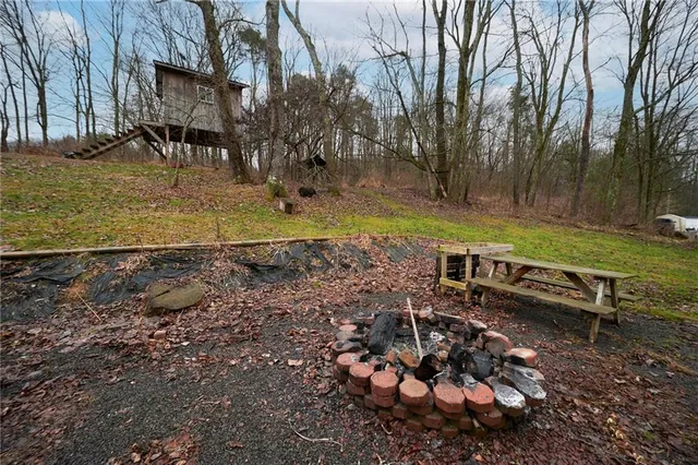 a fire hydrant in the middle of a field