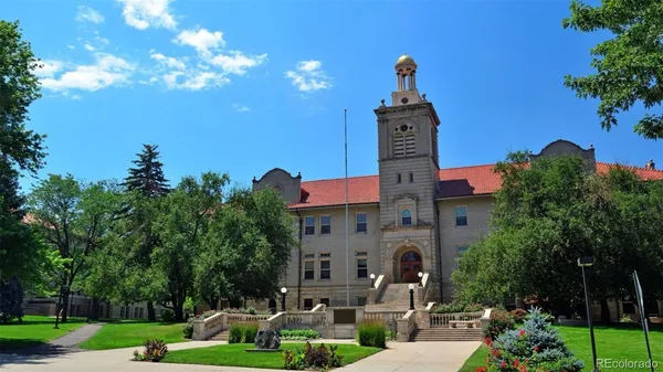 a front view of a building with garden