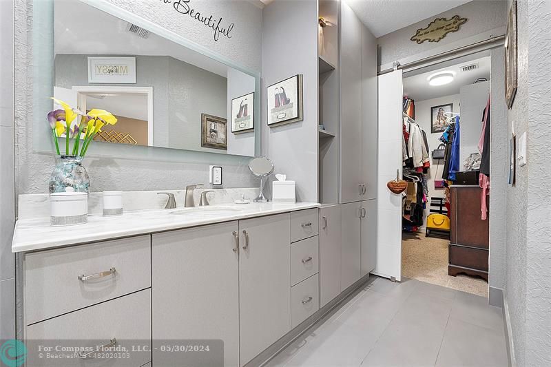 7774 Paddock Place, Unit 7774 Davie, FL 33328 - Photo 20 of 28 a bathroom with a double vanity sink and a mirror