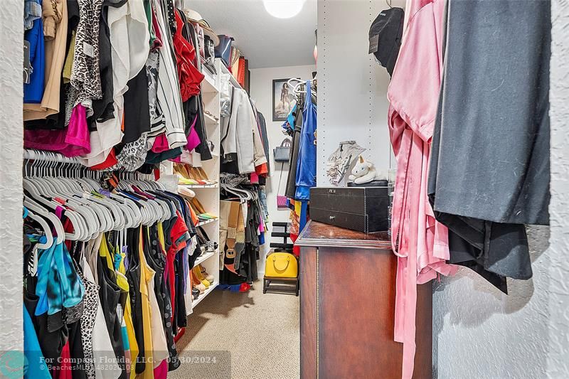 7774 Paddock Place, Unit 7774 Davie, FL 33328 - Photo 21 of 28 a view of walk in closet with clothes