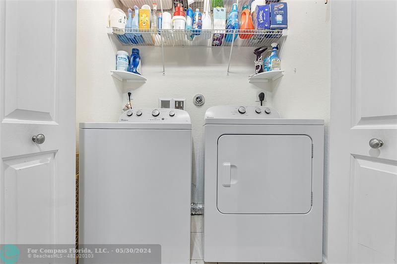 7774 Paddock Place, Unit 7774 Davie, FL 33328 - Photo 24 of 28 a utility room with dryer and washer