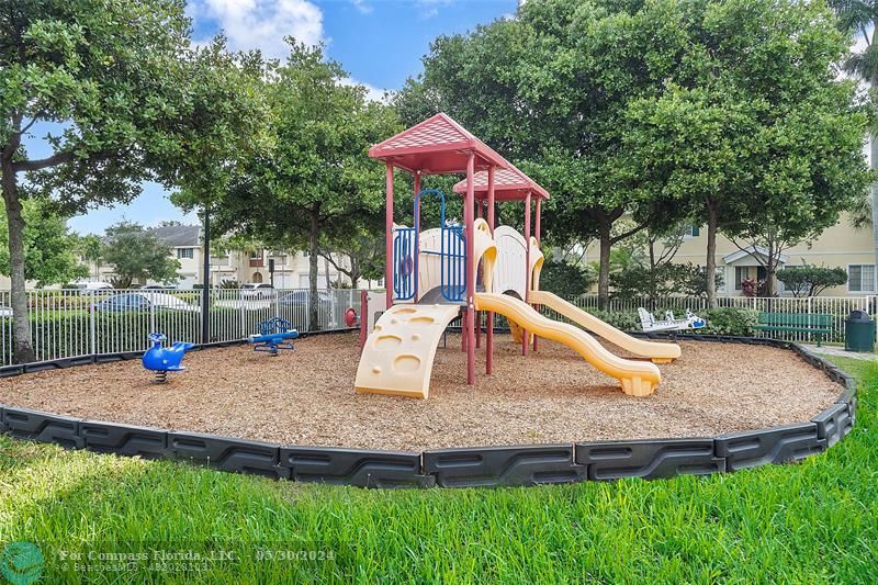 7774 Paddock Place, Unit 7774 Davie, FL 33328 - Photo 26 of 28 a view of a house with swimming pool and porch